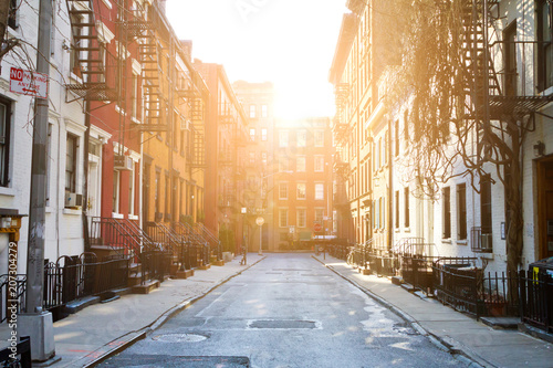 Sunlight shines on historic buildings along Gay Street in Greenwich Village neighborhood of Manhattan in New York City