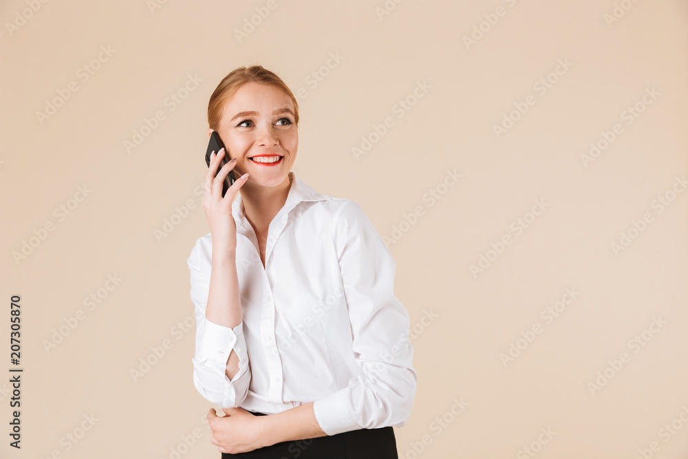Happy young business woman talking by mobile phone. Happy young business woman talking by mobile phone.