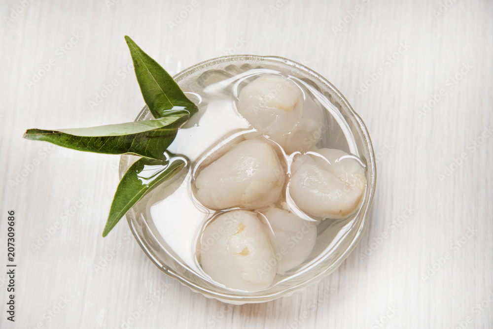 Lychee casing in the cup and fruit. Lychee casing in the cup and fruit.
