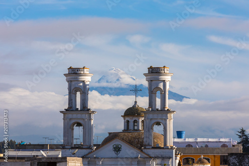 Ecuador Latacunga town Merced church with Cotopaxi volcano in the background  at sunrise photo