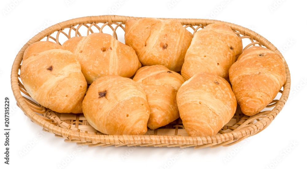 Croissants in basket with chocolate cream on white background isolated
