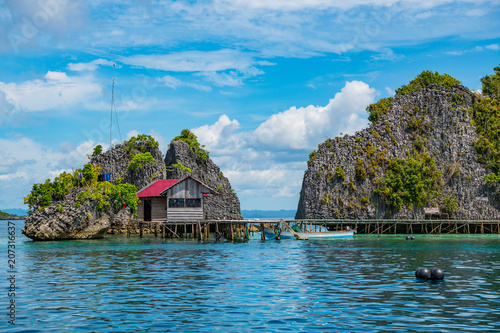 East Misool, group of small island in shallow blue lagoon water, Raja Ampat, West Papua, Indonesia photo