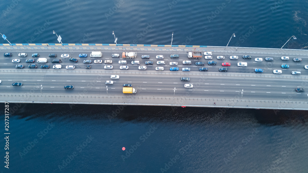 Aerial top view of bridge road automobile traffic jam of many cars from above, city transportation concept
Aerial top view of bridge road automobile traffic jam of many cars from above, city transportation concept