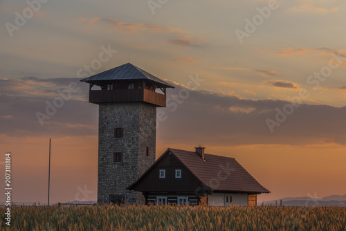 Color sunset near Roprachtice village with observation tower