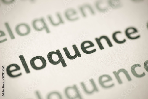 Фотография word eloquence printed on paper macro