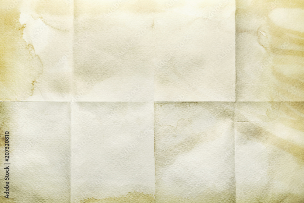 Fototapeta premium Empty sheet folded in eight, old paper with stained edges