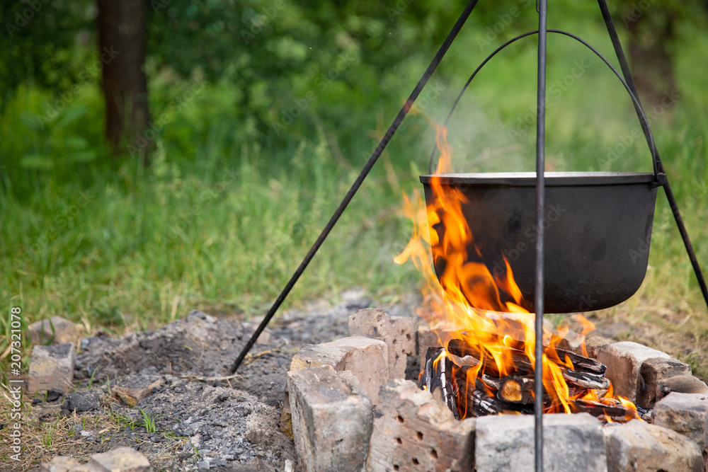 cooking in a cauldron at the stake cooking in a cauldron at the stake