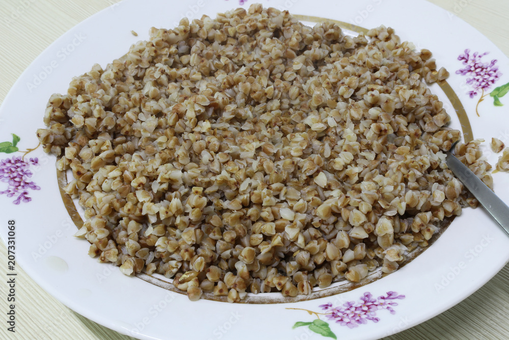 Buckwheat porridge in a ceramic plate Buckwheat porridge in a ceramic plate