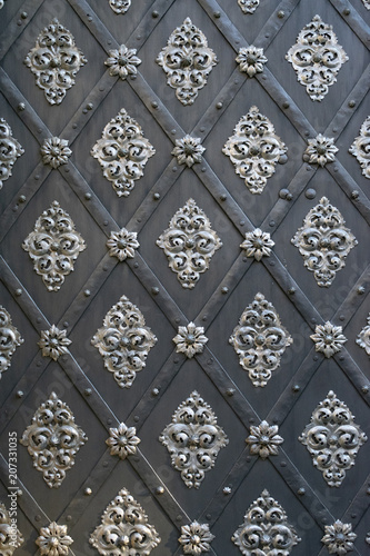 old iron vintage black door with steel decor as background
