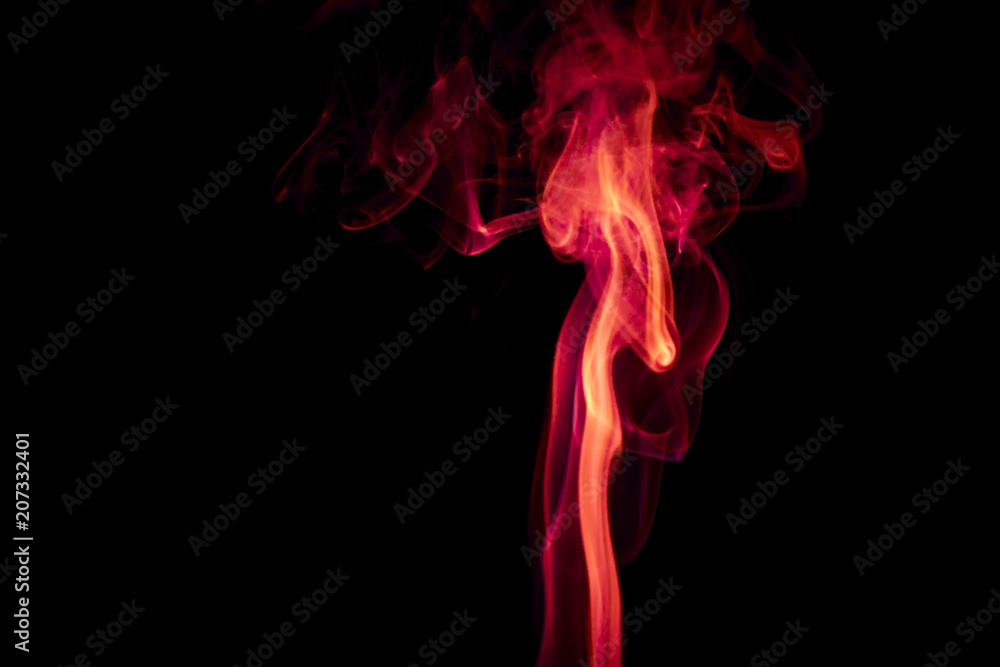 Obraz premium Red smoke on black background