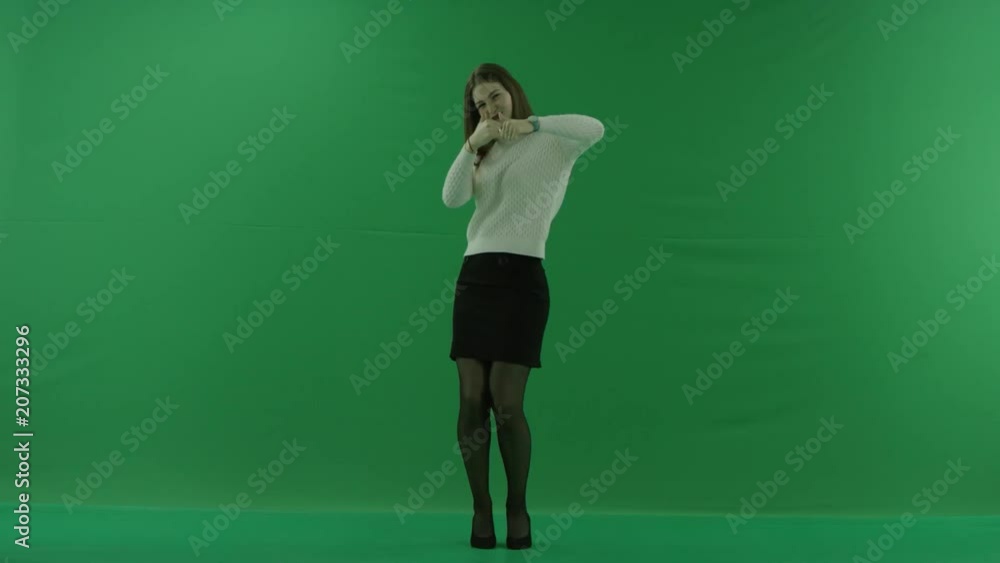 girl showing thumbs up to the camera and dancing on green screen girl showing thumbs up to the camera and dancing on green screen