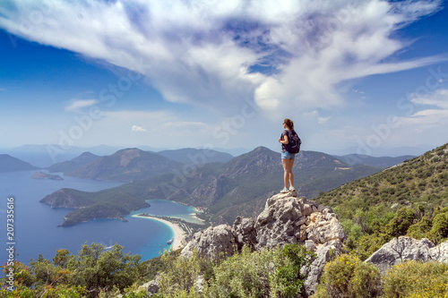 Hiker girl on the mountain top. Sport and active life concept. Oludeniz, Turkey