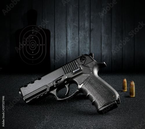 Hand Gun and Bullets atthe Shooting Range