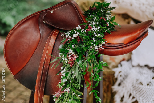 saddle rider decor flowers green branches
