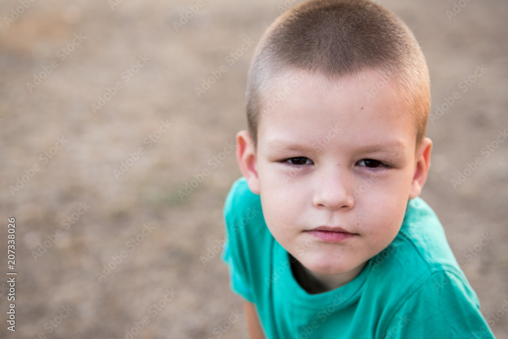 Portrait of Happy child on walk in village. Active leisure and outdoor sports for children. Portrait of Happy child on walk in village. Active leisure and outdoor sports for children.