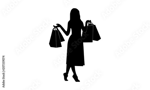 silhouette of women with shopping bags