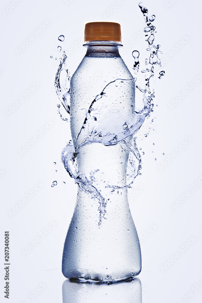 Splash of water in plastic bottle blue background Splash of water in plastic bottle blue background