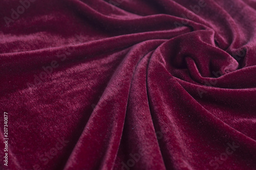 Red velvet fabric with spiral folds