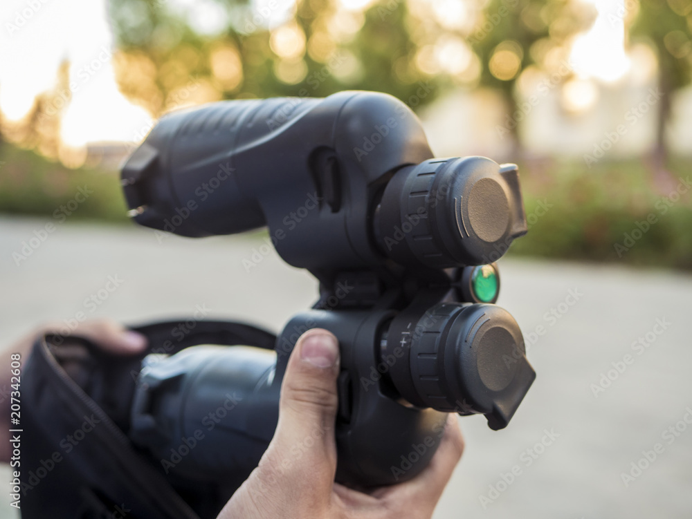 close up binoculars in the hands of tourist