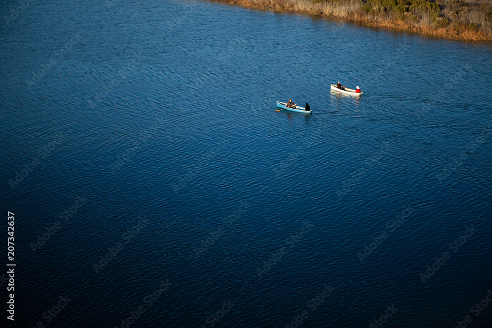 Boaters in River