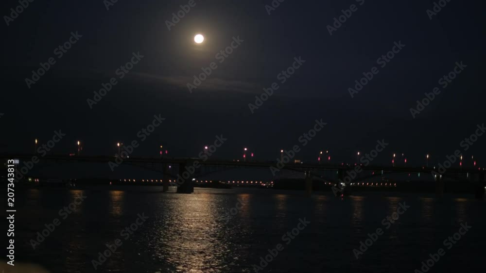 A view of the night city by the river bank. A view of the night city by the river bank.