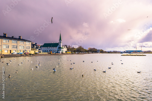 Reykjavik - May 02, 2018: Panorama of Reykjavik from the Tjornin Lake, Iceland photo