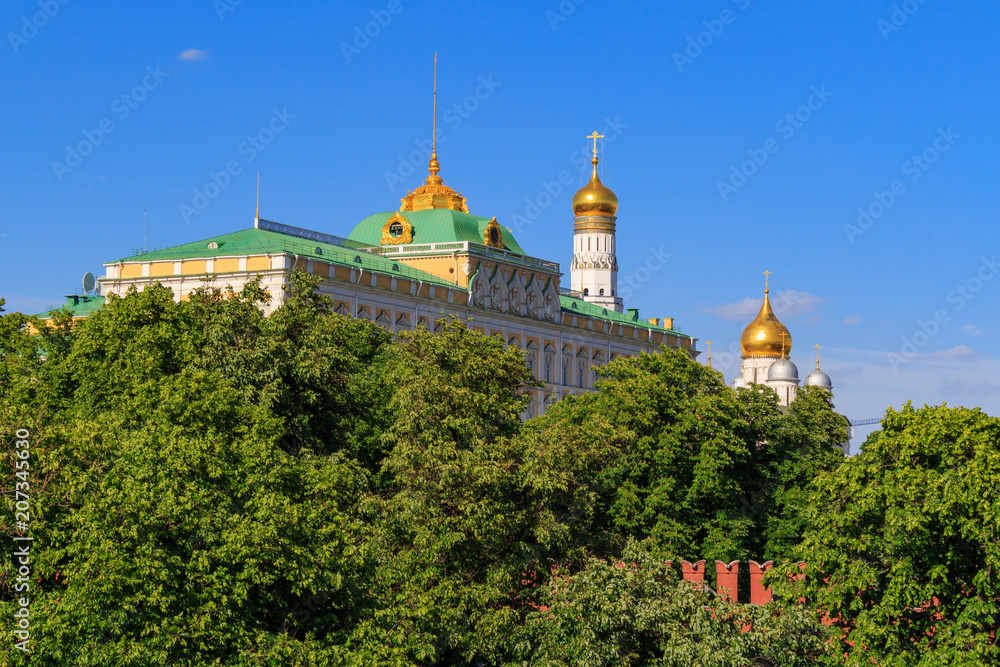 Grand Kremlin Palace on a blue sky background in sunny evening