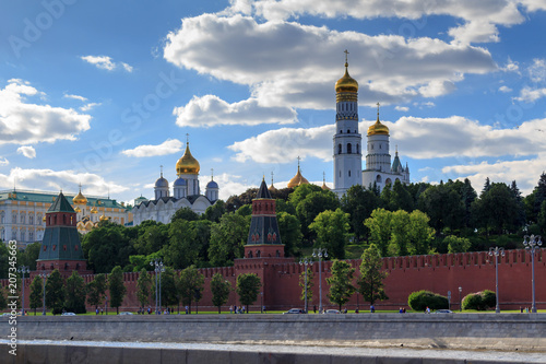 Domes of Moscow Kremlin churches against cloudy blue sky