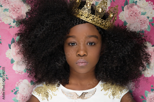 Close up of girl wearing crown photo