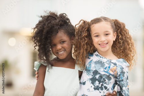 Portrait of smiling girls standing together