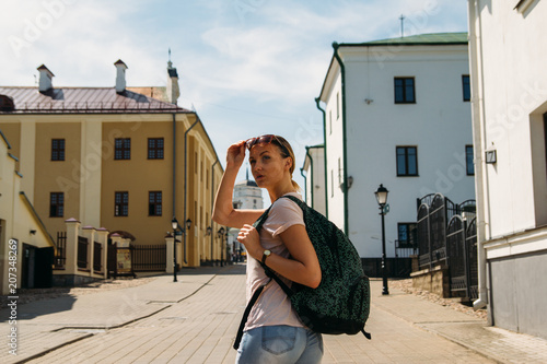 woman puts up the sunglasses photo