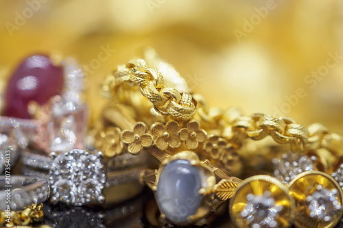 Luxury Jewelry diamond rings with reflection on black and golden background