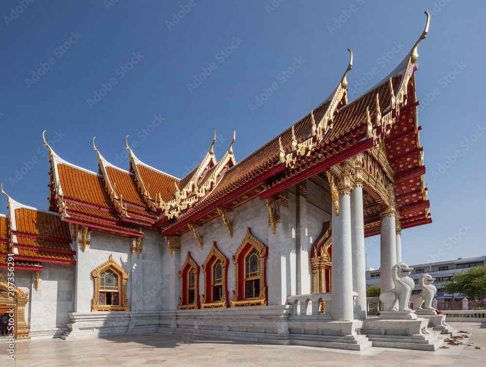 The beautiful facade of Wat Benchamabophit – designed by the half brother of King Chulalongkorn, Prince Naris, in 1899 it is contructed of Italian marble The beautiful facade of Wat Benchamabophit – designed by the half brother of King Chulalongkorn, Prince Naris, in 1899 it is contructed of Italian marble