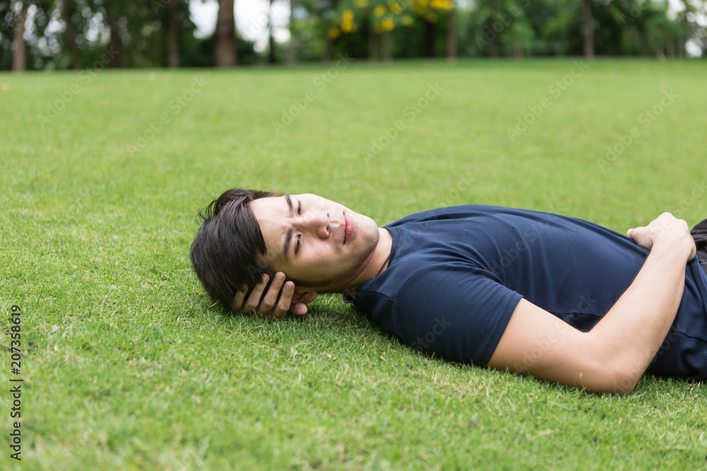 Fitness man have rest after training in park. Fitness man have rest after training in park.