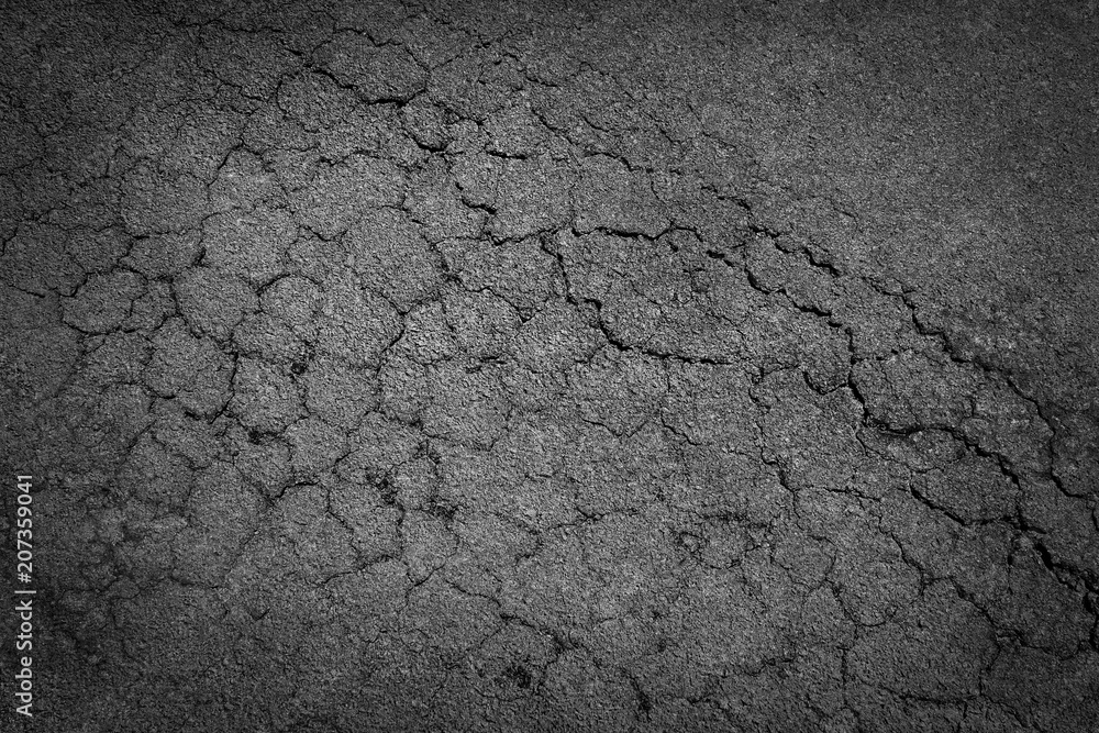 Fototapeta premium crack background texture of rough asphalt