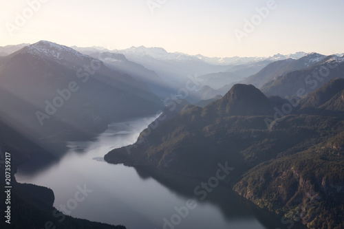Striking Aerial View of the Canadian Mountain Landscape during a vibrant sunny day. Taken at Pitt Lake, North of Vancouver, British Columbia, Canada. © edb3_16