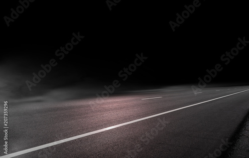 Road asphalt on black background with mist or fog © releon8211
