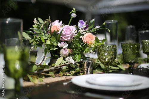 Rustic Wedding Decor Pink, Peach, Purple, and Green Floral Centerpieces on a Wooden Farm Table