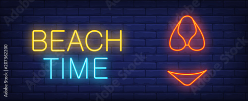 Beach time vector illustration in neon style. Colorful text and red bikini on brick wall background. Night bright advertising design, banner, sign. Summer and vacation concept