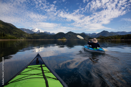 Kayaking during a vibrant morning surrounded by the Canadian Mountain Landscape. Taken in Stave Lake, East of Vancouver, British Columbia, Canada. Concept: Adventure, vacation, holiday © edb3_16