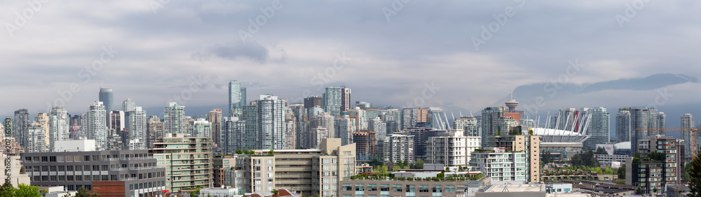 Vancouver, British Columbia, Canada - May 18, 2018: Panoramic view of Developed Downtown City during a cloudy morning.