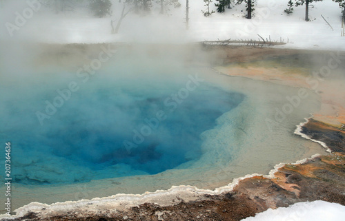 Fototapeta Naklejka Na Ścianę i Meble -  Hot spring thermal pool during winter in the upper geyser basin Yellowstone National Park in Wyoming United States