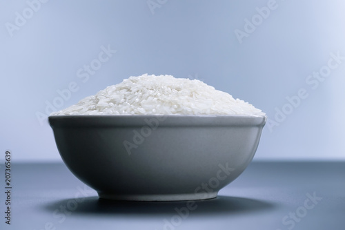 bowl of jasmine white rice on black backgrounds