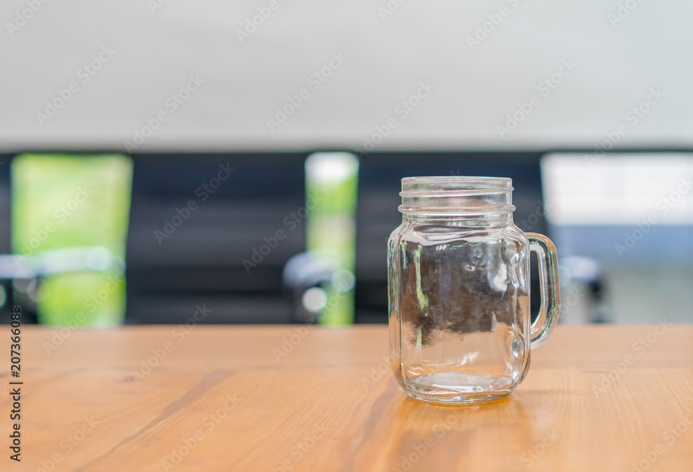 Empty glass jar rests on the table. Empty glass jar rests on the table.