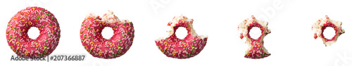фотография The process of eating a donut with colorful sprinkles isolated on white background