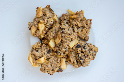 Homemade oatmeal cookies on plate on the white background. view from above.