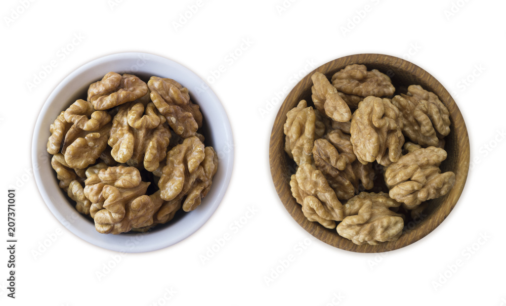 Kernels walnuts isolated on white. Walnuts in a bowl isolated on white background. Walnuts with copy space for text on a white background Kernels walnuts isolated on white. Walnuts in a bowl isolated on white background. Walnuts with copy space for text on a white background
