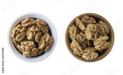 Kernels walnuts isolated on white. Walnuts in a bowl isolated on white background. Walnuts with copy space for text on a white background