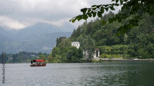 Traditional wooden boat, pletna on lake Bled photo