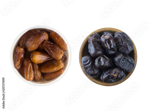 Date fruit isolated on a white background. Bowl of dried dates isolated on white background. Dried dates with copy space for text. Top view. Dates on white background. Delicious fresh organic dates.